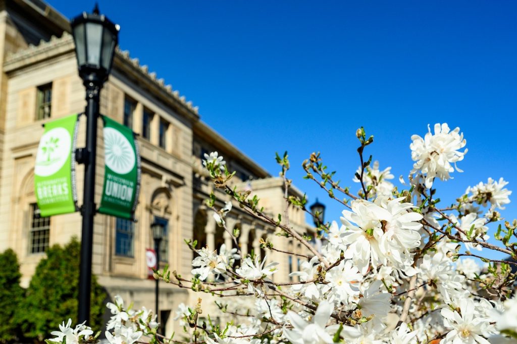The Memorial Union is pictured with blooming spring flowers in the late afternoon sun at the University of Wisconsin-Madison on April 24, 2019. (Photo by Bryce Richter /UW-Madison)